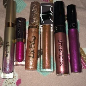 Various glittered lip stick/glosses never used